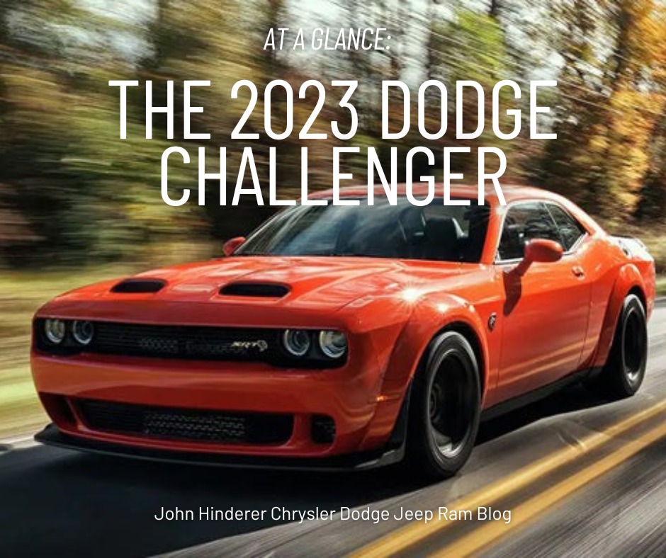 A photo of an orange 2023 Dodge Challenger driving down the highway and the text: At a Glance: The 2023 Dodge Challenger - John Hinderer Chrysler Dodge Jeep Ram Blog
